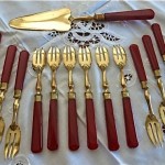 vintage set forks and server bakelite and vermeil