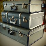 trio of vintage suitcases for display