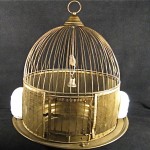 vintage victorian brass bird cage with milk glass feeders