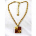 vintage givenchy amber lucite logo necklace