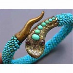 antique turquoise coiled snake bracelet with garnet eyes