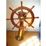 antique ships wheel on bronze pedestal