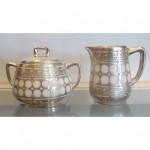 antique sterling silver over porcelain cream and sugar set