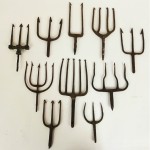 collection of antique hand forged fishing spears