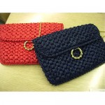 vintage pair of rodo straw clutches