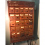 vintage w. c. heller sioux city seed cabinet z