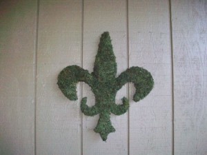 lady welder fleur de lis mossed scrupture