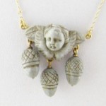 antique 14k carved lava cherub necklace