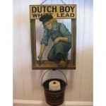 vintage dutch boy tin string holder sign