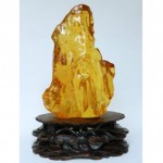 antique chinese stand with natural amber chunk