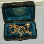 antique 1900s dragon brooch with ruby eyes