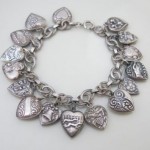 vintage 1940s sterling repousse puffy heart charm bracelet