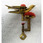 antique 1890s traum sewing bird pin cushion clamp