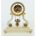 antique french swinging cherub clock